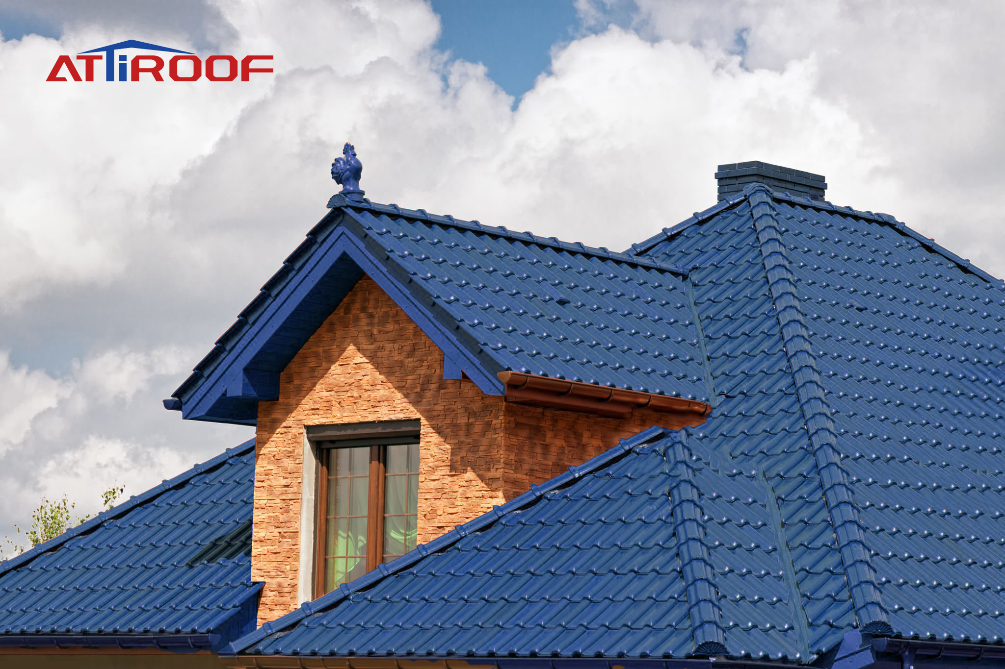 Renovated museum with a vibrant blue synthetic resin tile roof, harmonizing with the classic brick architecture, against a cloudy sky backdrop.