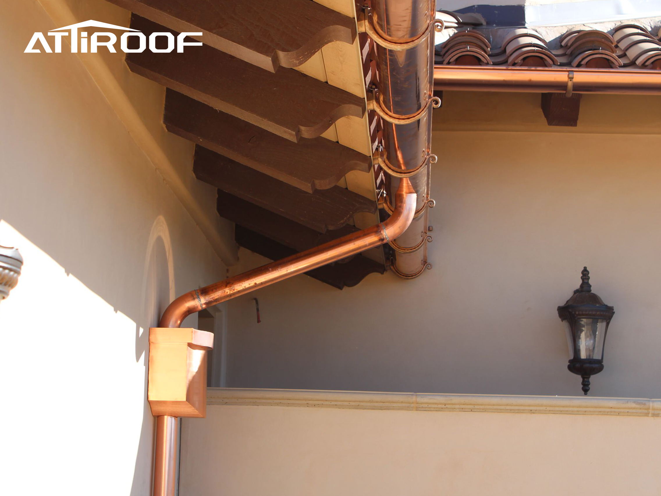 This copper drainage system consists of curved copper pipes connected to the roof for discharging rainwater or wastewater.