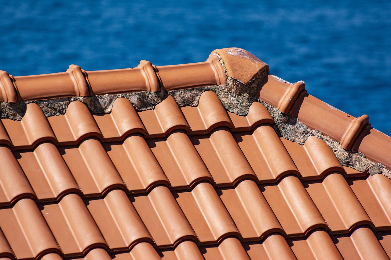 The neatly arranged red tiles are tightly connected, each tile presenting a regular arc and clear texture.