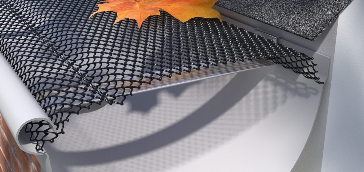 Close-up of a gutter system with a mesh guard, preventing leaves and debris from clogging.