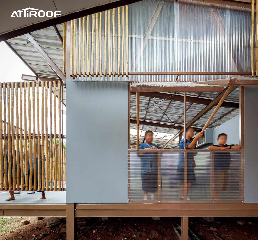 Image showcasing clear polycarbonate roof sheeting used in a school library, highlighting its practical and transparent properties.