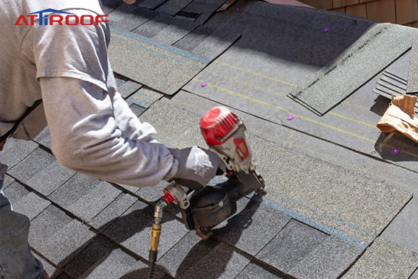 Workers laid asphalt shingles on the roof.